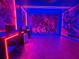 Amazing game room featuring avengers decor and vibrant neon lights at 10437 Ebb Tide Ln, Orlando, FL 32821