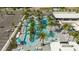 Aerial view of the lazy river with palm trees and lounge seating at the community pool at 10437 Ebb Tide Ln, Orlando, FL 32821