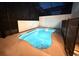 Private pool on back patio, surrounded by a white wall and a mesh fence at 10437 Ebb Tide Ln, Orlando, FL 32821