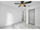 Bright bedroom with a modern ceiling fan, fresh white paint, and beautiful marble floors at 1136 Twin Rivers Blvd, Oviedo, FL 32766