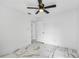 Bright bedroom with a modern ceiling fan, fresh white paint, and beautiful marble floors at 1136 Twin Rivers Blvd, Oviedo, FL 32766