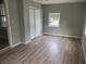 Inviting bedroom features laminate flooring, a spacious closet, and ample natural light at 1303 37Th Nw St, Winter Haven, FL 33881