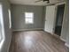 Bright bedroom featuring laminate flooring and natural light at 1303 37Th Nw St, Winter Haven, FL 33881