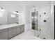 Stylish bathroom featuring a glass shower, sleek vanity, and marble-look tile at 13062 Sunrise Harvest Dr, Winter Garden, FL 34787