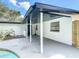 Covered patio area adjacent to the pool, offering a shady spot for relaxation at 1382 Wright St, Daytona Beach, FL 32117