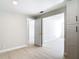 Bright living room featuring neutral paint, an open doorway, and light wood flooring at 1382 Wright St, Daytona Beach, FL 32117