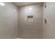 Shower with tiled walls and convenient recessed shelving for toiletries at 1428 Oak Pl # J, Apopka, FL 32712