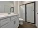 Modern bathroom with a glass-enclosed shower, white vanity, and updated fixtures at 15052 Mayberry Dr, Winter Garden, FL 34787