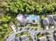 Birds-eye view of a community pool and playground, surrounded by lush trees in the heart of a residential neighborhood at 15052 Mayberry Dr, Winter Garden, FL 34787