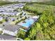 Aerial view of a community pool surrounded by lush greenery and well-maintained lawns near the neighborhood at 15052 Mayberry Dr, Winter Garden, FL 34787