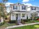 Charming two-story home with a covered front porch and nicely landscaped front yard at 15052 Mayberry Dr, Winter Garden, FL 34787