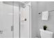 Clean bathroom featuring a glass-enclosed shower, modern fixtures, and a toilet at 1569 Plunker Dr, Davenport, FL 33896