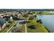 Beautiful aerial view of a residential neighborhood next to a scenic lake on a bright, sunny day at 1619 Leatherback Ln, St Cloud, FL 34771