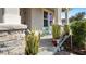 Inviting front porch area featuring stone accents, plants, and a cozy seating area at 1619 Leatherback Ln, St Cloud, FL 34771