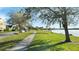 Paved sidewalk along the lakefront is perfect for walking, jogging, or enjoying scenic views at 1619 Leatherback Ln, St Cloud, FL 34771