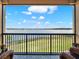 Scenic balcony view overlooking a lush lawn and serene lake, perfect for relaxation at 16300 County Road 455 # 201, Montverde, FL 34756