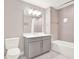 Bathroom features a single sink vanity, tiled shower and tub, and tile flooring at 16300 County Road 455 # 201, Montverde, FL 34756