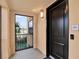 Unit 201 entryway features a large door with a Ring doorbell and a window with view at 16300 County Road 455 # 201, Montverde, FL 34756