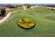 Aerial view of lush green golf course with flower design and manicured landscaping at 16300 County Road 455 # 201, Montverde, FL 34756