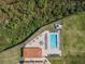 Overhead shot of community pool featuring ample seating, cabana, and lush landscaping at 16300 County Road 455 # 201, Montverde, FL 34756