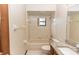 Well-lit bathroom includes bathtub, shower, granite countertop, and tiled floor at 1811 Springwood Ln, Deltona, FL 32725