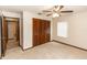 Bedroom featuring neutral carpet, closet, and window for plenty of natural light at 1811 Springwood Ln, Deltona, FL 32725