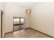 Bright dining room featuring tile floors, sliding glass doors, and a modern chandelier at 1811 Springwood Ln, Deltona, FL 32725