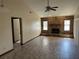 Open-plan living area with a brick fireplace, tiled flooring and vaulted ceilings at 1811 Springwood Ln, Deltona, FL 32725