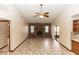 Bright living room with vaulted ceiling, fireplace, and tile floors at 1811 Springwood Ln, Deltona, FL 32725