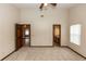 Spacious main bedroom features a ceiling fan, two closets, and ensuite bathroom access at 1811 Springwood Ln, Deltona, FL 32725