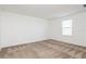 Bedroom featuring neutral carpet, a window providing natural light, and a serene atmosphere at 1950 Birnham Wood Bnd, Kissimmee, FL 34746