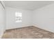 Bedroom featuring neutral carpet, a window providing natural light, and a serene atmosphere at 1950 Birnham Wood Bnd, Kissimmee, FL 34746