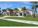 Community clubhouse entrance with modern design and well-maintained landscaping at 1950 Birnham Wood Bnd, Kissimmee, FL 34746