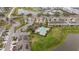 Aerial view of community with pool, clubhouse, and ponds in a suburban neighborhood at 209 Arbor Lakes Dr, Davenport, FL 33896