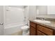 Well-lit bathroom features a single vanity and shower-tub combo at 209 Arbor Lakes Dr, Davenport, FL 33896