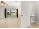 Bathroom featuring a pedestal sink and tile flooring next to the living area at 209 Arbor Lakes Dr, Davenport, FL 33896