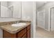 Bathroom features vanity with solid surface countertops and ceramic sink at 209 Arbor Lakes Dr, Davenport, FL 33896