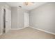 A neutral bedroom is shown with carpet flooring and a ceiling fan at 209 Arbor Lakes Dr, Davenport, FL 33896