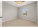 Bright bedroom featuring neutral paint, plush carpet, ceiling fan, and a window offering natural light at 209 Arbor Lakes Dr, Davenport, FL 33896