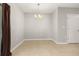 Well lit dining area with elegant hanging chandelier and neutral color scheme at 209 Arbor Lakes Dr, Davenport, FL 33896