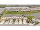 Inviting townhome with attached garage, beautiful lake view, and well-maintained landscaping at 209 Arbor Lakes Dr, Davenport, FL 33896