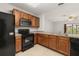 Functional kitchen with stainless steel appliances, ample cabinetry, and a breakfast bar at 209 Arbor Lakes Dr, Davenport, FL 33896