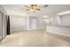 Bright living room featuring tile floors, ceiling fan, and sliding glass doors leading to the backyard at 209 Arbor Lakes Dr, Davenport, FL 33896