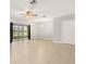 Bright living room featuring tile floors, ceiling fan, and sliding glass doors leading to the backyard at 209 Arbor Lakes Dr, Davenport, FL 33896