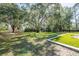 A spacious backyard with mature trees that provide plenty of shade at 2721 Ingeborg Ct, Windermere, FL 34786