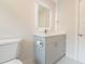 Bright bathroom featuring a vanity with lighted mirror and white fixtures at 2721 Ingeborg Ct, Windermere, FL 34786