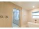 Well-lit bathroom with tub, shower, and modern vanity, offering a clean and sophisticated design at 2721 Ingeborg Ct, Windermere, FL 34786