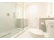 Bright bathroom featuring a glass shower and modern white cabinets at 2721 Ingeborg Ct, Windermere, FL 34786