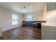 Bright bedroom featuring hardwood floors, modern built-in desk and shelving, and abundant natural light at 2721 Ingeborg Ct, Windermere, FL 34786