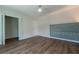 Bright bedroom with wood flooring and unique cushioned headboard design at 2721 Ingeborg Ct, Windermere, FL 34786